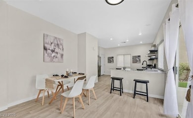Dining room featuring light wood finished floors,