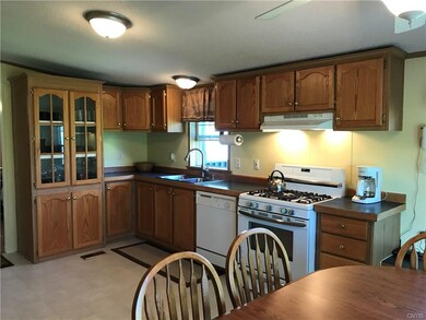 Large kitchen with abundance of cabinets and count