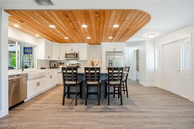 Dining area featuring wooden ceiling and light har