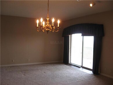 Living room/dining room combo opens to balcony
