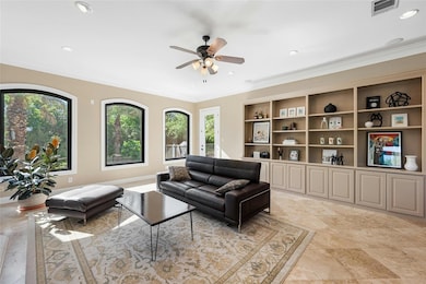 Living room featuring ornamental molding, recesse