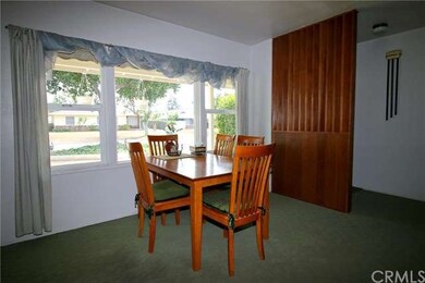 Dining area and original doorbell on the wall near