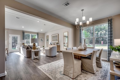 Dining area featuring lofted ceiling with beams, w