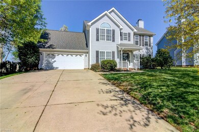Two-car garage plus paved driveway- plenty of space for parking, storage, or workshop space!