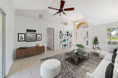 The foyer opens up to your formal living and dining areas under VAULTED CEILINGS with oversized TILE FLOORS, a comfortable space to host family and friends or additional FLEXIBLE space for whatever else you might need! Virtually Staged. 