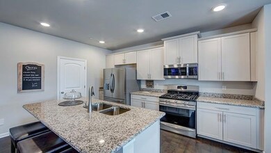 Lots of cabinets and island seating.  Granite and SS appliances.  All photos of another home.  Finishes will vary.