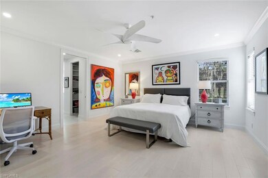 Bedroom featuring a walk in closet, ceiling fan, c