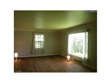 Huge living room with picture window and hard wood