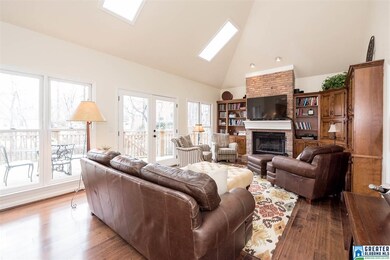The den is so inviting with built-in cabinetry, co