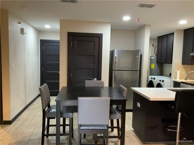 Dining room featuring separate washer and dryer and water heater