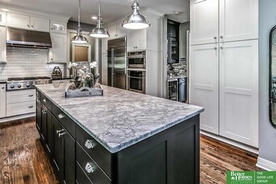 Fall in LOVE with this NEW kitchen!  GE Monogram stainless steel appliances!  Double oven, gas cooktop, custom cabinets, stunningly beautiful granite island, hand scraped wood floors!