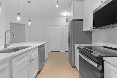 Kitchen featuring appliances with stainless steel
