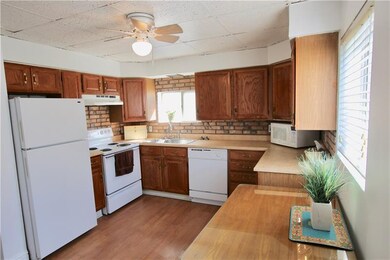 Pretty Oak Kitchen with lots of cabinet space.