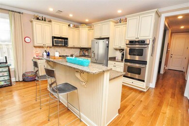 A large island with bar seating adjoins the kitche