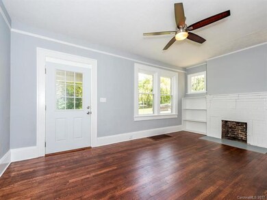Living Space with Original Fireplace & Built-ins