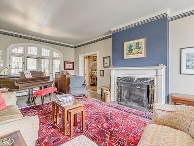 Large living room with wood burning fireplace.