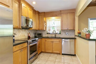 Wood cabinets, granite counter tops, stone back sp