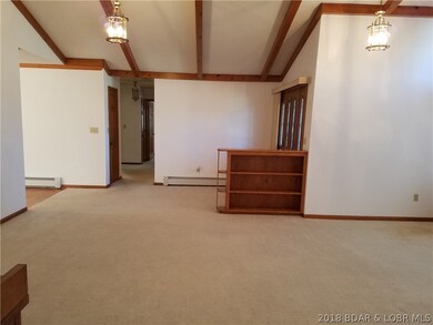 Living area with vaulted ceilings