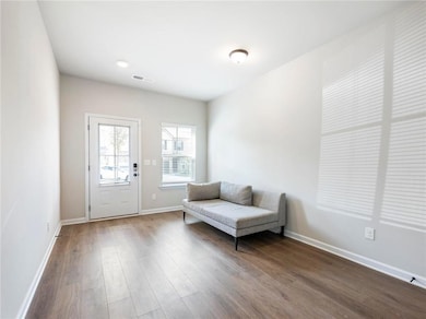Unfurnished room with dark hardwood / wood-style f