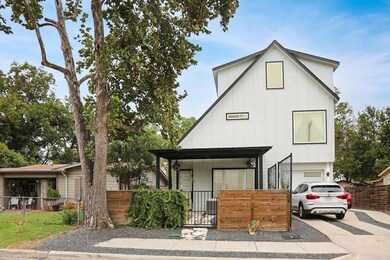 View of front facade with driveway, a garage, a f