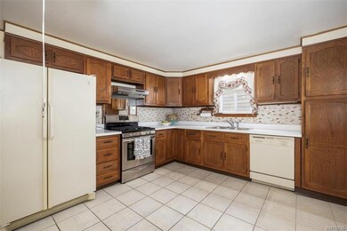 Large kitchen with SS gas stove, Appliances stay with the home, Convey in as-is condition.