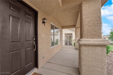 Entrance to property with stucco siding