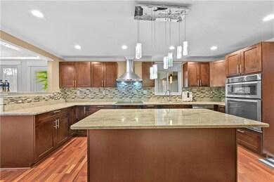 Kitchen with decorative backsplash, a center islan