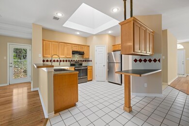 Kitchen featuring a peninsula, visible vents, app