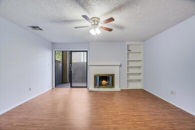 Unfurnished living room with built in shelves, wo