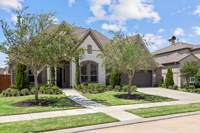 The wide driveway not only provides ample parking