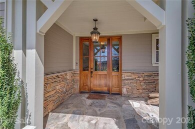 Stunning front door entrance, with the mountains reflecting on the glass