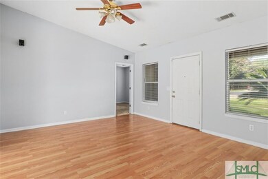 Living room with door to front entry
