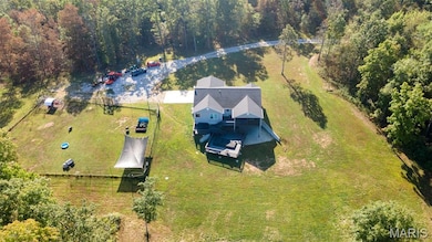 View from above of property with a heavily wooded area