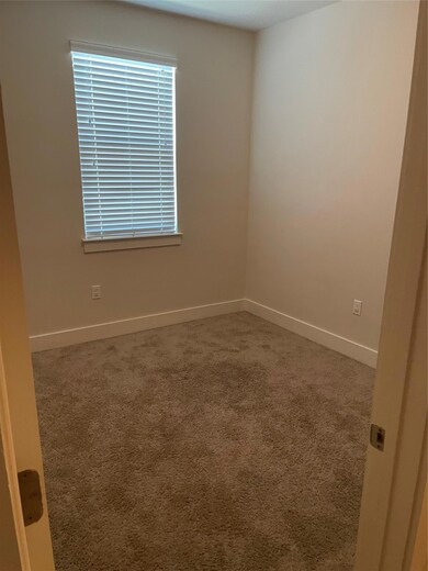 Spare room with carpet floors and baseboards
