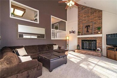 Family room with floor to ceiling brick fireplace