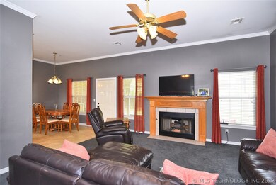 Living room has fireplace with gas logs.