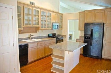Chef's kitchen with upgraded cabinets, rich wood f