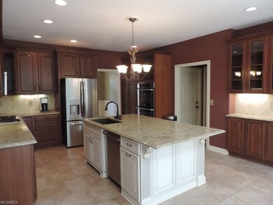 Grand kitchen with Cherry cabinetry and huge islan
