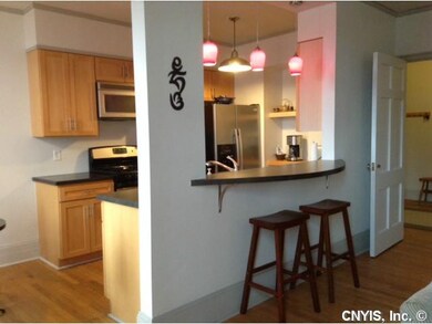 Kitchen breakfast bar offers an open pass thru bet