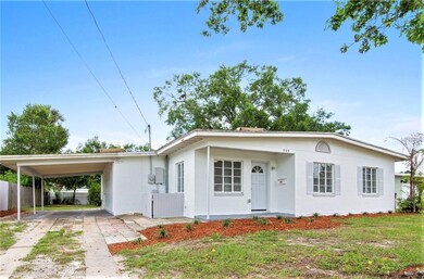 Covered carport with access into backyard