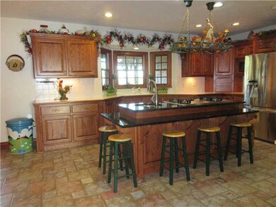 Kitchen. Ceramic tile floor, recessed lighting, is