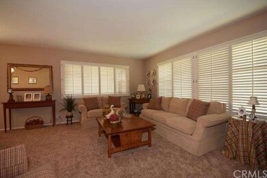 Formal living room, new carpet, plantation shutter
