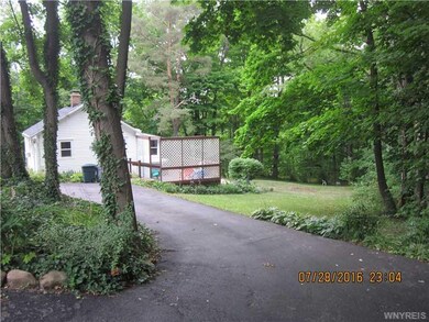 Exterior Front. Circular driveway and extra parkin