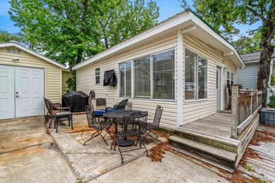 View of patio with grilling area, outdoor dining a