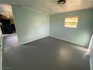 Unfurnished room featuring concrete floors