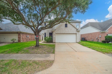 Traditional home with a front yard, concrete driv