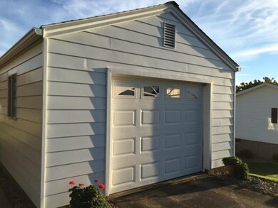 Garage with automatic garage door opener.