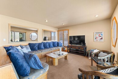 Wool Carpeted living area with recessed lighting