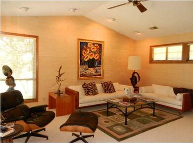 Living Room with Vaulted Ceiling Boasts Openness.