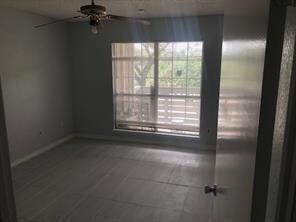 Spare room with a wealth of natural light and a ce